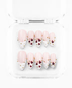 Love Notes press-on set: nude French almond nails with burgundy hearts and pearl studs