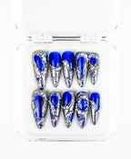 Midnight Blue press-on set: royal blue stilettos framed in molten silver with pearls