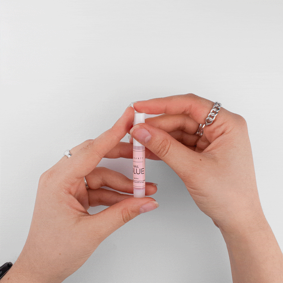 Holding the nail glue included in every beoopsie press-on nail set