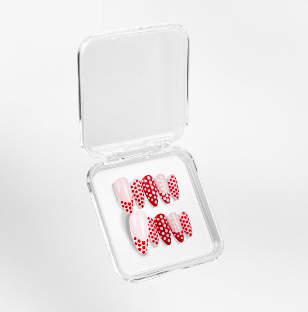 Ivory Cherries polka dot press-on nail set in its clear beoopsie case