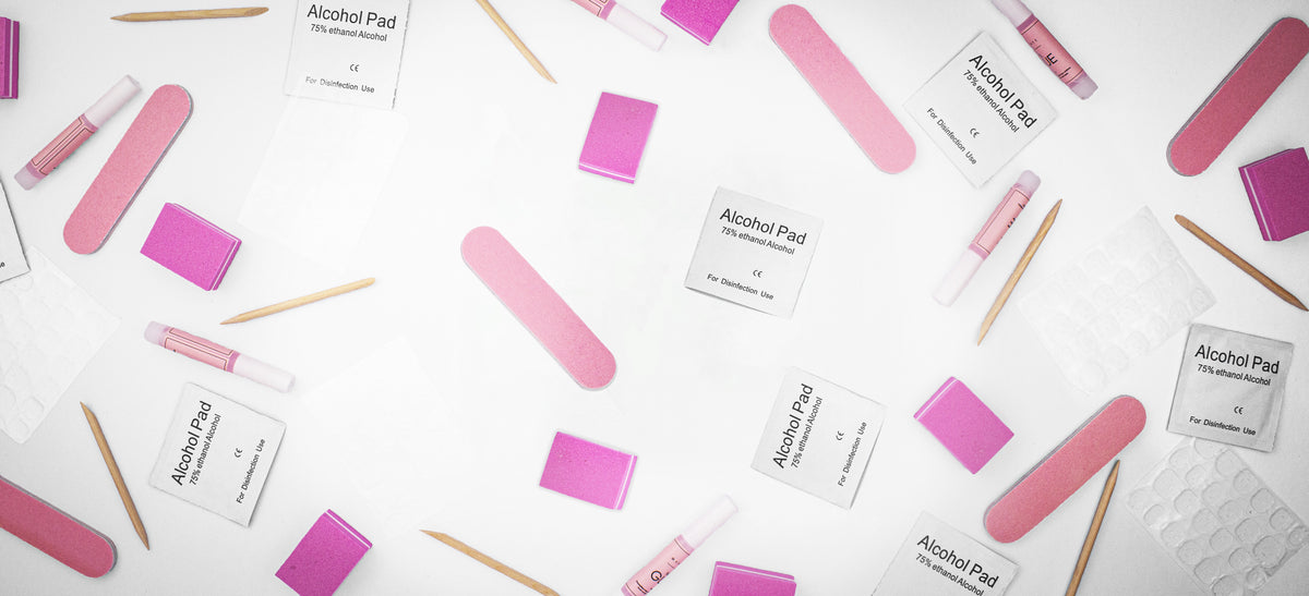 Flat lay of beoopsie kit tools: files, buffers, cuticle sticks and alcohol pads