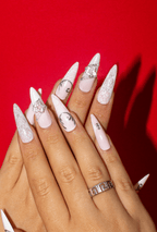 Winter Crown white lace press-on nails with rhinestone star charms on red