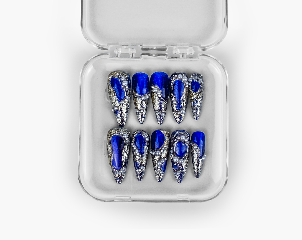 Midnight blue chrome press-on nails with silver foil accents