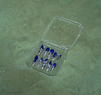 Midnight Blue press-on nail set in its case floating on rippling water