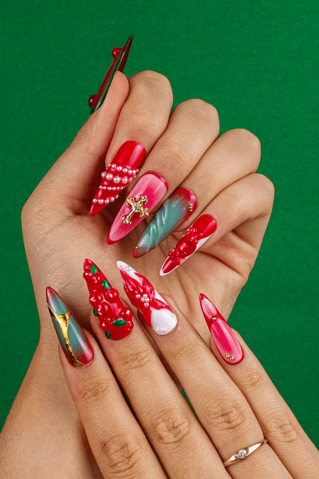 Christmas press on nails on hand - Cardinal's Blessing red stiletto design