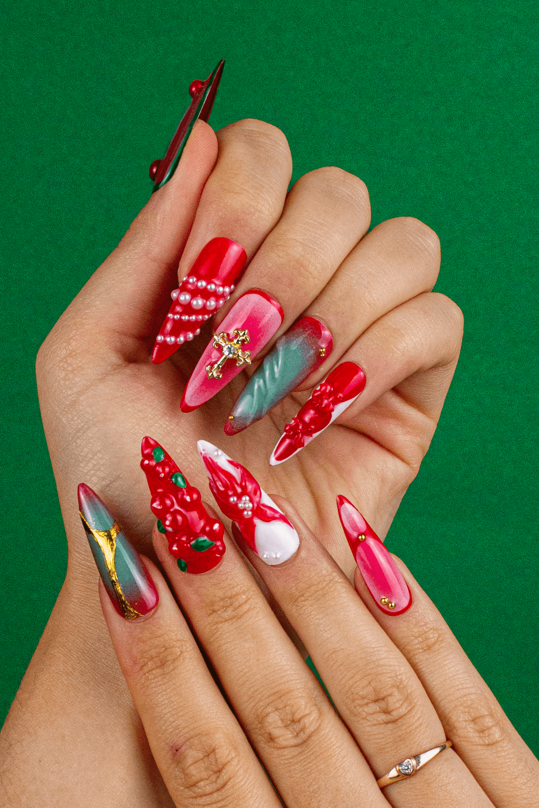 Christmas press on nails on hand - Cardinal's Blessing red stiletto design